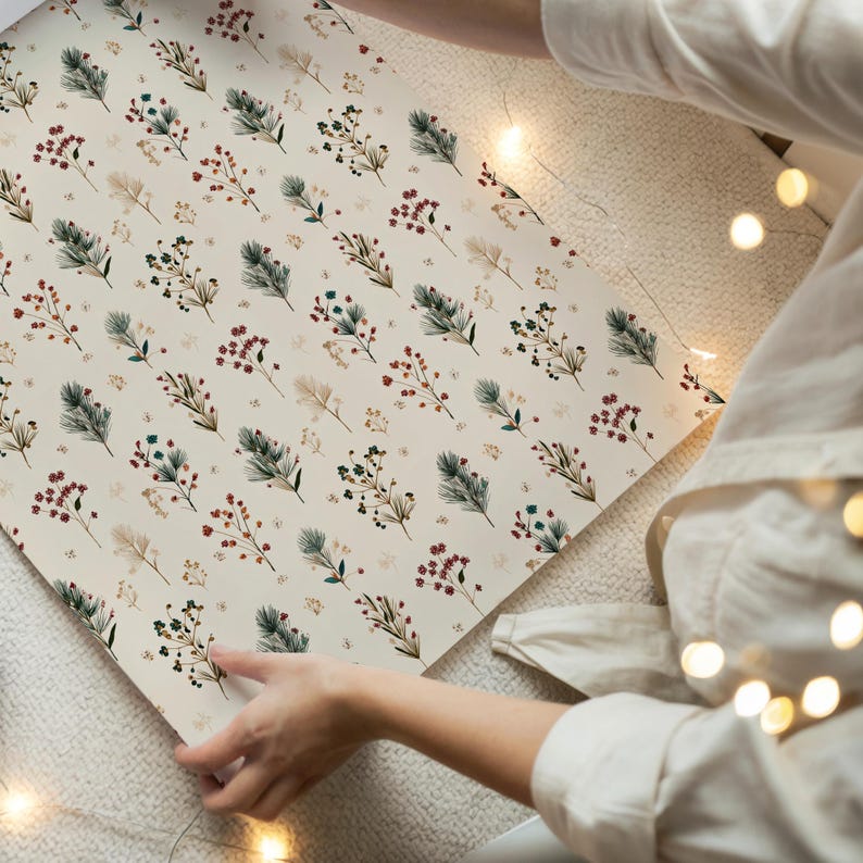 Neutral Noel aesthetic wrapping paper with botanical tree branch design, perfect for DIY holiday present wrapping.