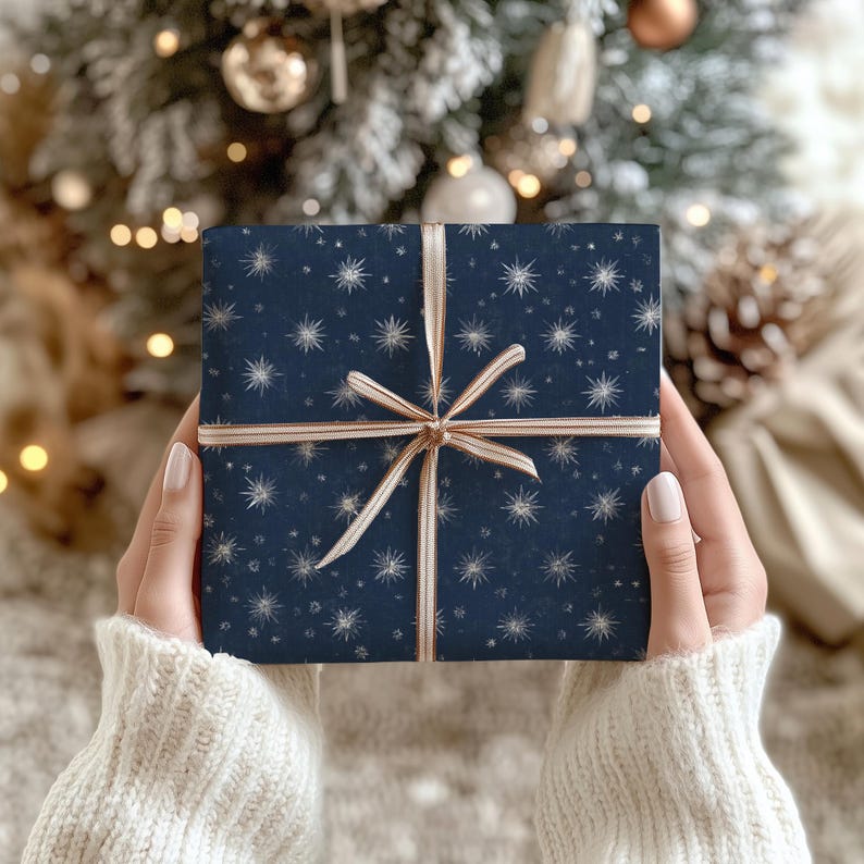 Vintage style navy blue Christmas wrapping paper featuring silver star design, perfect for holiday gift packaging