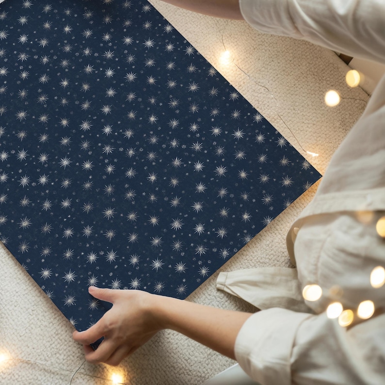 Elegant dark blue Noel gift wrap decorated with silver stars, vintage inspired paper for Christmas presents
