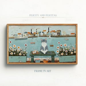 以下が含まれることがあります： 港の風景を見下ろす木製のベンチに座っている猫を描いた額縁付きの絵画。猫は灰色と白で緑色の目。港はボートと建物でいっぱい。絵画のタイトルは「Felicity and Felicitas」で、「Frame TV Art」の署名があります。