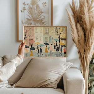 Cute spring umbrella artwork featuring a soft village scene in pastel colors, ideal for seasonal wall accents.