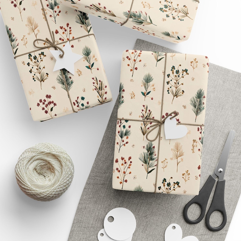 DIY gift wrap paper with botanical Christmas tree branch artwork, a stylish and natural holiday packaging idea.
