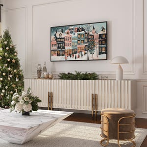 Instant home decor idea with retro Christmas Samsung Frame TV art showing a charming winter village scene.