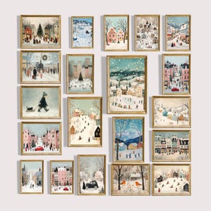 May include: A collection of framed winter landscape paintings. The artwork features scenes of snowy towns, people, and trees. The paintings are in gold frames and vary in size, creating a gallery wall effect. The color palette includes blues, whites, and warm tones.