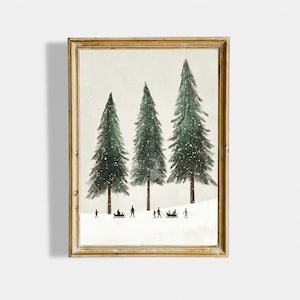 May include: A framed art print depicting three evergreen trees in a snowy scene. Small figures are sledding and walking in the snow. The artwork has a vintage style and is presented in a gold-coloured frame.