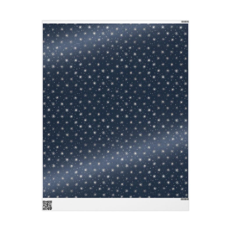 May include: A rectangular sheet with a dark blue background covered in small, white star shapes. A lighter blue, curved stripe runs diagonally across the sheet. The bottom edge has a white border.
