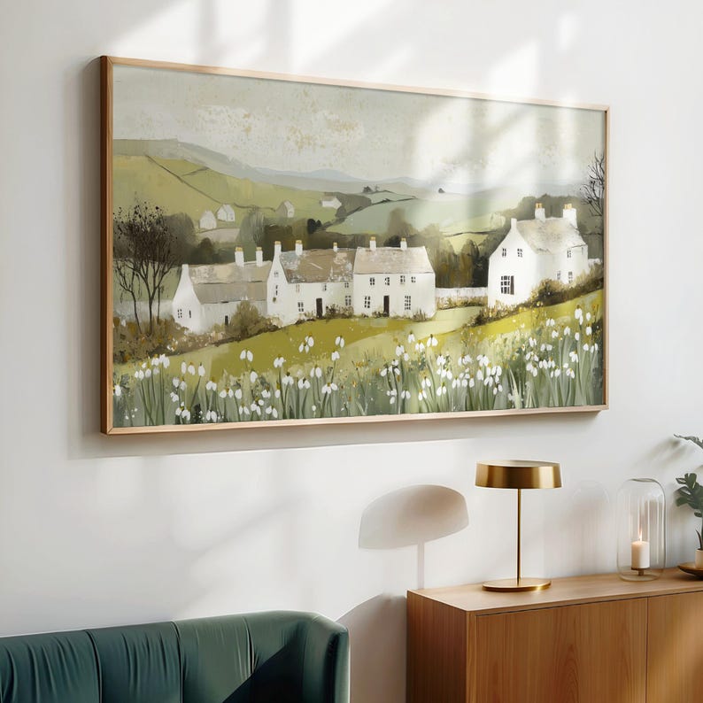 May include: A painting depicting a row of white houses with green roofs set against a rolling green landscape. The houses are surrounded by a field of white flowers. The sky is a light blue with white clouds.