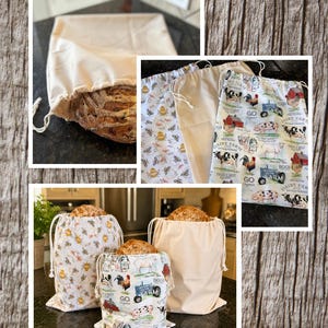 May include: A collection of fabric drawstring bags for bread, measuring 13 inches by 17 inches. The bags feature solid beige fabric or patterns with bees, honeycombs, or farm animals like cows, pigs, and chickens. Each bag holds a loaf of sourdough bread.