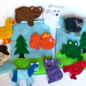 May include: Felt finger puppets for children, including a brown bear, a white dog, a black sheep, a yellow duck, a red fish, a green frog, a blue horse, a purple cat, a red bird, and a girl with brown hair and glasses.