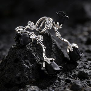 May include: A set of three ceramic nesting bowls in shades of blue, green, and white. The bowls feature a speckled glaze and a simple, modern design. The largest bowl is approximately 6 inches in diameter.