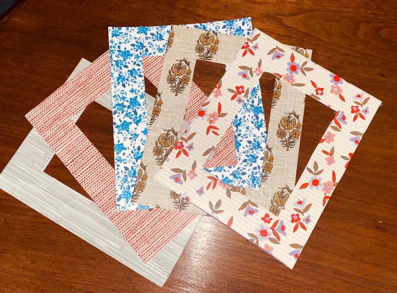 Custom Photo Matte, Patterned Picture Frame Matting, Handmade Home Decor
 A collection of decorative picture frames with various floral and geometric patterns.