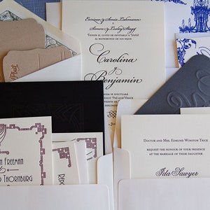 May include: An assortment of wedding invitations and stationery. The designs include various fonts and layouts, with some cards featuring embossed details and decorative borders. Colors include cream, black, and brown.
