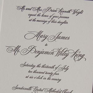 May include: Elegant wedding invitation with black script on a white background. The text includes names, date, and time of the ceremony. The invitation is for the marriage of Mary James to Mr. Benjamin Wiley King.