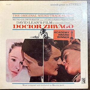 May include: Vintage vinyl record album cover for "Doctor Zhivago." The cover features images of the film's stars and the text "Academy Award Winner." The album is a Metro-Goldwyn-Mayer production.