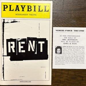May include: A Playbill program for the musical RENT at the Nederlander Theatre, featuring a black and white cover with the title in bold letters. Beside it is a white insert slip announcing that Aisha de Haas plays the role of Mrs. Jefferson.