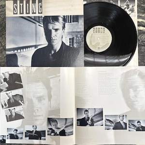 May include: A vinyl record album titled Sting, featuring a black and white cover portrait of the artist, a black vinyl disc with a central label, and an open gatefold sleeve displaying multiple black and white photographs and printed lyrics.