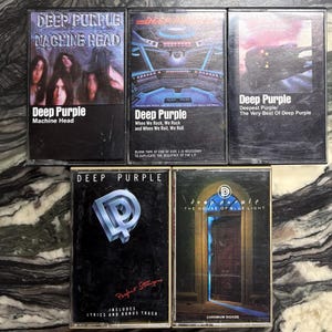 May include: Five Deep Purple cassette tapes. Titles include "Machine Head", "When We Rock, We Rock and When We Roll, We Roll", "Deepest Purple/The Very Best Of Deep Purple", "Perfect Strangers", and "The House of Blue Light".