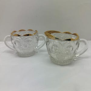 Vintage glass sugar and creamer with gold rim