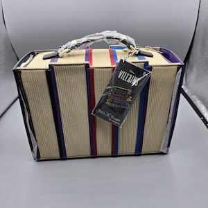 May include: A set of three ceramic mugs with a speckled, matte finish. The mugs are in shades of cream, light grey, and dark grey. Each mug has a simple, minimalist design and a rounded handle.