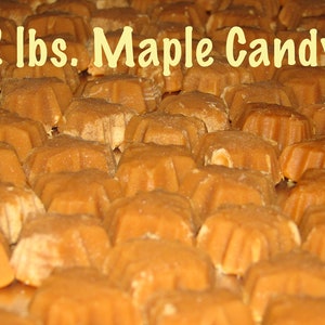 May include: Two pounds of maple candy in individual star-shaped pieces. The candy is a light brown color and is arranged in rows on a metal surface.