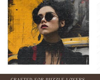 May include: A jigsaw puzzle featuring a portrait of a woman wearing sunglasses, with a yellow and black background. The puzzle is rectangular and has a matte finish. The text "CRAFTED FOR PUZZLE LOVERS" is at the bottom.