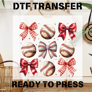 May include: White t-shirt with a red and white gingham bow, a red bow, and baseballs with red stitching. The text "DTF TRANSFER READY TO PRESS" is printed on the bottom of the shirt.
