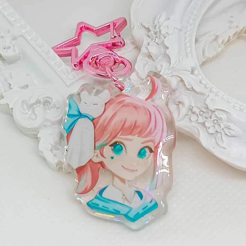 Overwatch mini keychains featuring Pink Mercy, Dokiwatch Juno, Rainy Day Kiriko, and Rainy Day Mei. Each is 1.5 inches with double-sided glitter epoxy and a broken glass holographic effect on one side. Cute Overwatch gift for support mains, gamer girls, and fans of OW2 skins and collectibles. Great for bags, backpacks, and keys. Handmade fanmade merchandise for Overwatch lovers and kawaii gaming aesthetic. Painted and produced by Chryssv.
