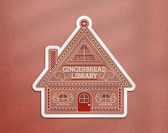 May include: A sticker depicting a gingerbread house with the words "GINGERBREAD LIBRARY". The house is brown with red detailing on the door, windows, and roof. The background is a solid reddish-brown colour.