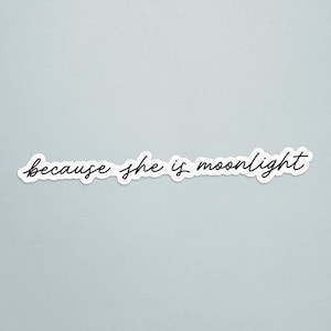 May include: A white sticker with the phrase "because she is moonlight" in a black, cursive font. The sticker is on a light blue background. The text is the focal point of the image.