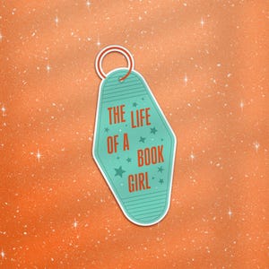 May include: A teal and white keychain with the text "THE LIFE OF A BOOK GIRL" in red. The keychain has a retro motel style design with a silver ring. The background is orange with white star accents.