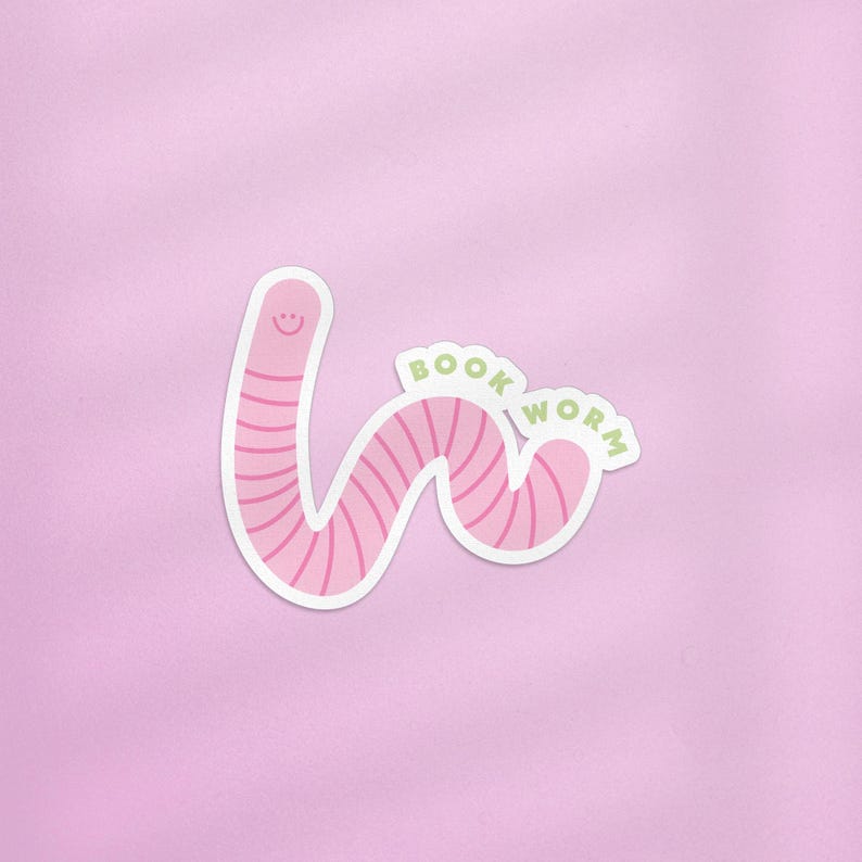 May include: Pink worm sticker with a smiling face and the text "BOOK WORM" in green.