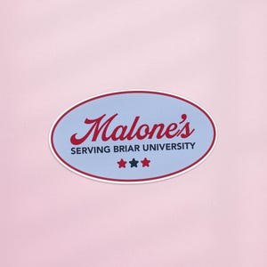 May include: An oval sticker with a light blue background and a red border. The sticker features the word "Malone's" in red script, with "SERVING BRIAR UNIVERSITY" below in smaller red text. Three red stars are at the bottom.