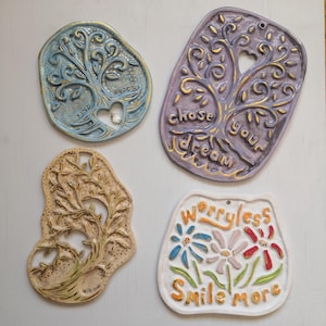 Handmade unique ceramic wall art design.Ceramic tree of life with slogan and floral wall hanging.