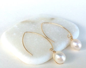 Classic White Pearl Drop Earrings on Marquise earring wires. Elegant and easy to wear. Approximately 1.5 " long, see listing for sterling