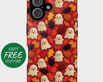 May include: A red phone case featuring a pattern of smiling ghost figures and autumn leaves in shades of orange, yellow, and brown. The case has a black camera module and the name "Jacqueline" is printed at the bottom.
