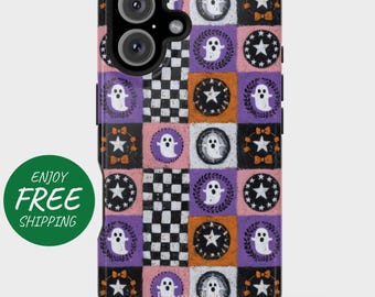 May include: A phone case with a repeating pattern of Halloween-themed squares. The squares feature ghosts, stars, and wreaths in white, black, orange, and purple on a pink background. The case has a black camera module.