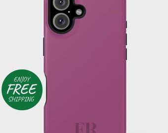 May include: A pink phone case with the initials "FR" printed on the back.