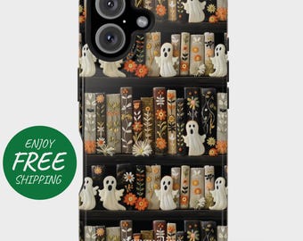May include: A phone case featuring a spooky bookshelf design with white ghost figures and floral accents. The case has a black background with a detailed illustration of books and decorative elements, perfect for Halloween.