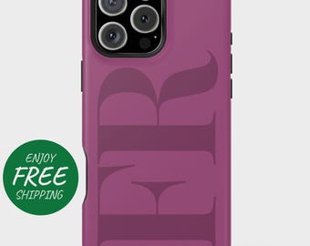 May include: A magenta phone case with a large, stylized "FR" design in a darker shade of magenta. The phone case has a black border and a green circle with the words "ENJOY FREE" in white.