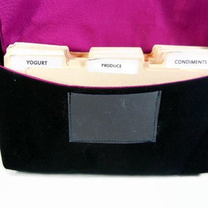 May include: A black fabric bag with a pink lining and three dividers labeled "Yogurt", "Produce", and "Condiments".