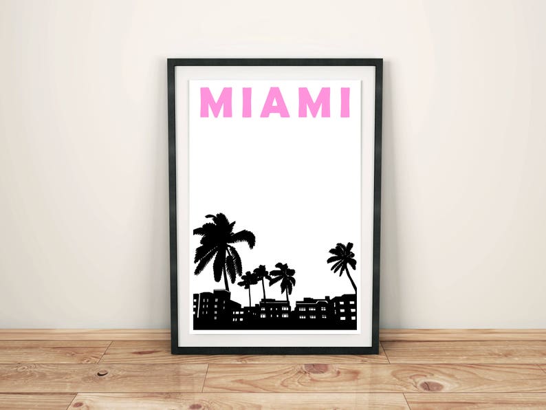 May include: A black and white print of palm trees and buildings with the word "MIAMI" in pink letters.
