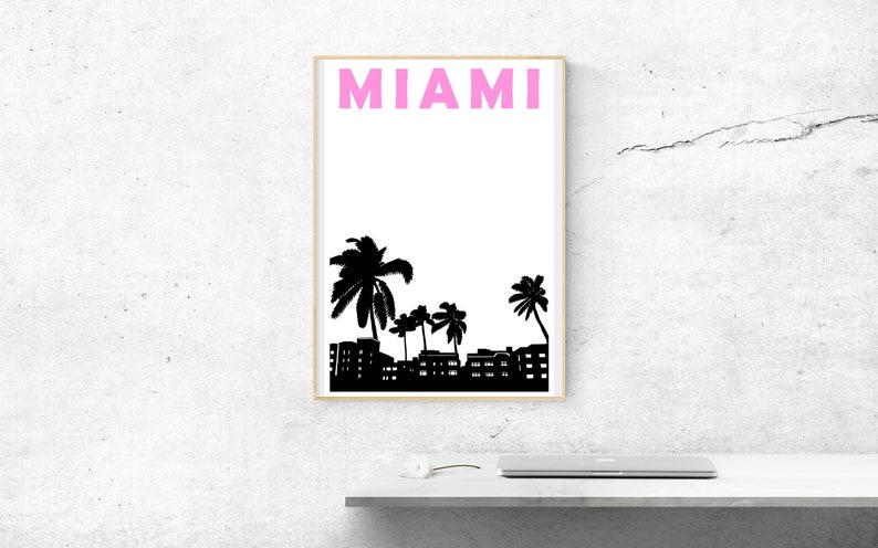 May include: A black and white print with the word "MIAMI" in pink letters. The print features a silhouette of palm trees and buildings.