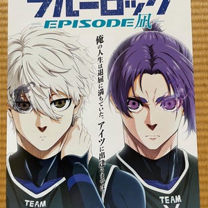May include: Anime film poster for "Blue Lock: Episode Nagi" with two male characters in sports attire. The title is in blue and white, with Japanese text above and below. The poster is dated 2024 and features the word "Episode" in English.