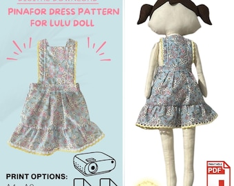 May include: Digital download pinafore dress pattern for Lulu doll. The pattern includes print options for A4-A0 and projector. The dress is light blue with a floral print and yellow trim. A doll wearing the dress is also shown.