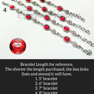 May include: Four silver bracelets with red gemstone accents. The bracelets are shown in different lengths, labeled 1.5 inches, 2.6 inches, 3.7 inches, and 4.8 inches.
