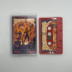 May include: A red cassette tape and case featuring the text "Baldur's Gate" in gold lettering. The cassette case has a colourful illustration of fantasy characters. The cassette tape is red with the same text.
