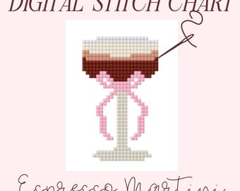 Può includere: Uno schema a punto croce per un espresso martini in un bicchiere da martini con un nastro rosa attorno al gambo. Lo schema è etichettato "Espresso Martini" e include un ago e un filo.