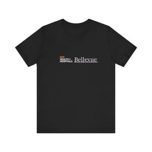 May include: Black t-shirt with a white logo that reads "NYC Health + Hospitals Bellevue".