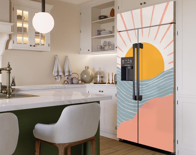 May include: A white refrigerator with a colourful abstract design featuring a sun, waves, and a pink and orange background. The design is reminiscent of a sunset over the ocean.