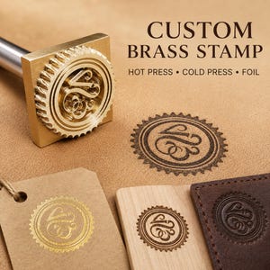 May include: A custom brass stamp with a circular serrated edge and a central monogram design. The stamp is shown with impressions on leather, wood, and paper, featuring the text CUSTOM BRASS STAMP, HOT PRESS, COLD PRESS, and FOIL.